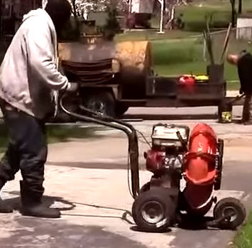 Blowing off an asphalt driveway