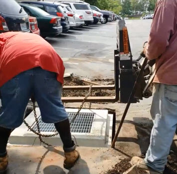 Installing Parking Lot Sewer Inlet