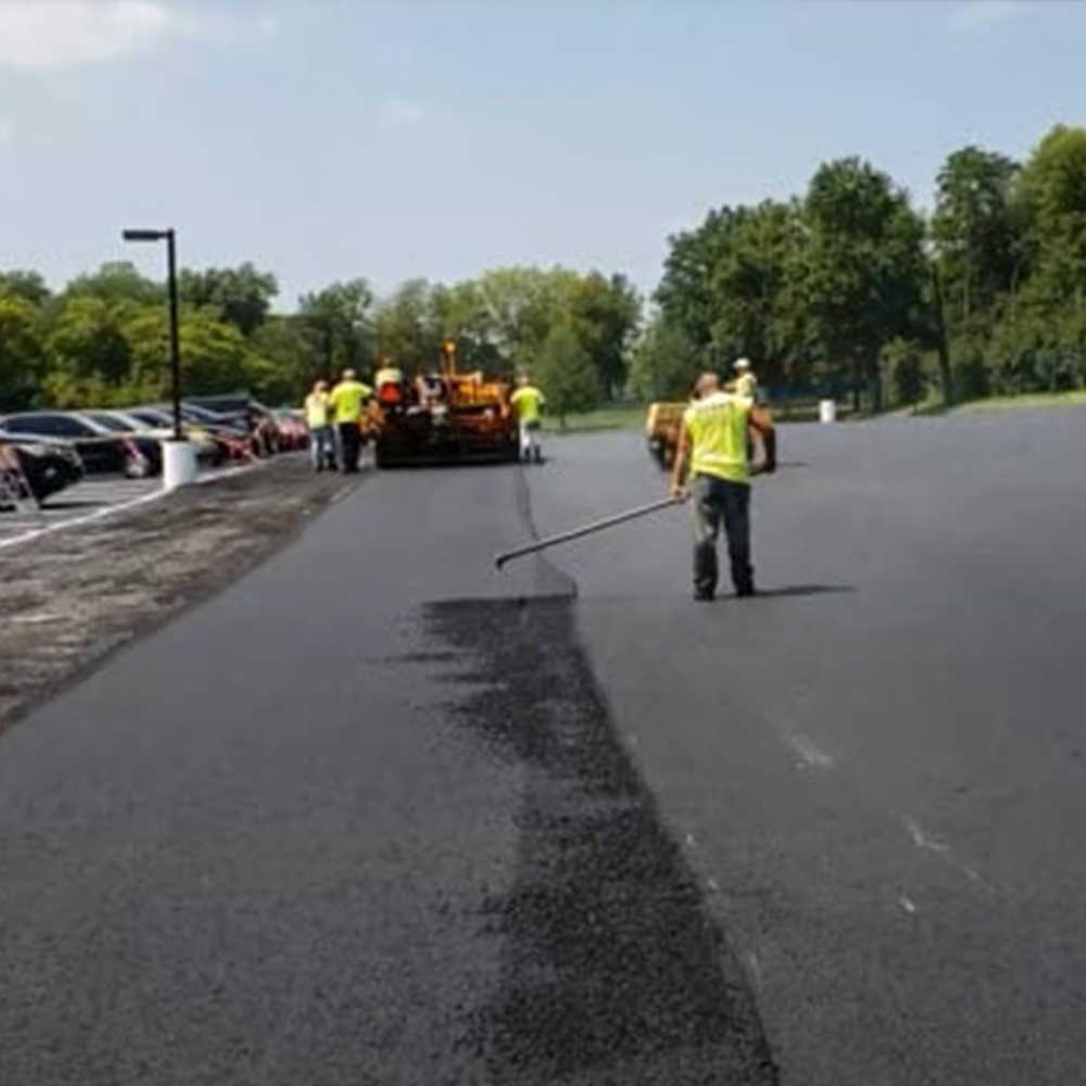 Lute Man Working an Asphalt Seam